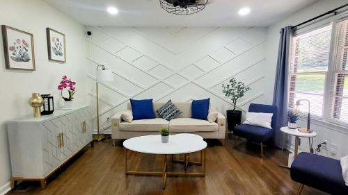 a living room with a couch and a table at Entire house in Old Town Lilburn 4 bedrooms 4 bath in Lilburn
