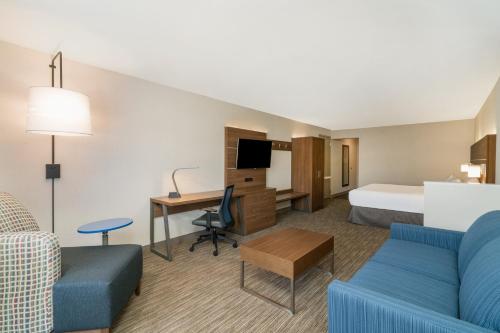 a hotel room with a bed and a desk at Holiday Inn Express Radcliff Fort Knox by IHG in Radcliff