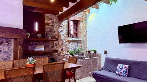 a living room with a table and a couch at Tizapan 01 NEW 1BE&1BA in Mexico City