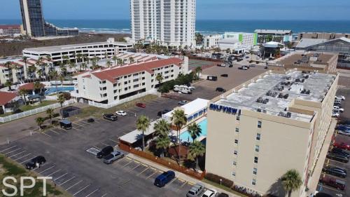 an aerial view of a city with a parking lot at Beach Access Condo with Pool, Hot Tub Area & BBQ - Gulfview I - unit 213 in South Padre Island