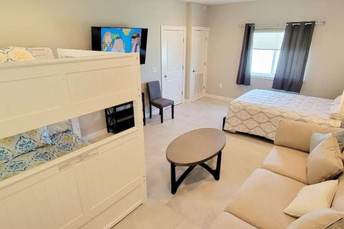 a living room with a bed and a bedroom with a couch at Bungalow Tarvana #2 home in Port Isabel