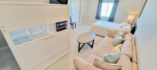 a living room with a couch and a bed at Bungalow Tarvana #2 home in Port Isabel