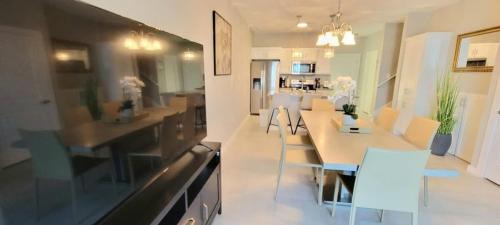 a kitchen with a dining table and chairs at Bungalow Tarvana #2 home in Port Isabel