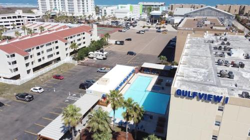an aerial view of a city with a parking lot at Great Family Condo with EZ Beach Access & SpaceX view Gulfview II #604 in South Padre Island