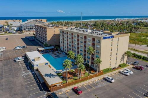 an aerial view of a hotel with a parking lot at Great Family Condo with EZ Beach Access & SpaceX view Gulfview II #604 in South Padre Island