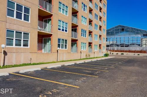 an empty parking lot in front of a building at Luxe 1 Bedroom House with Pool - Gulfview II unit 410 in South Padre Island