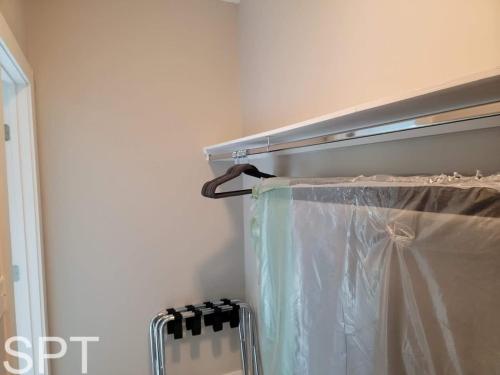 a refrigerator with a plastic curtain in a room at New Waterfront Bungalow - Fishermans Paradise - Bungalow Tarvana in South Padre Island