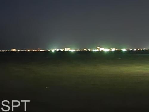 a view of a city at night with lights at New Waterfront Bungalow - Fishermans Paradise - Bungalow Tarvana in South Padre Island