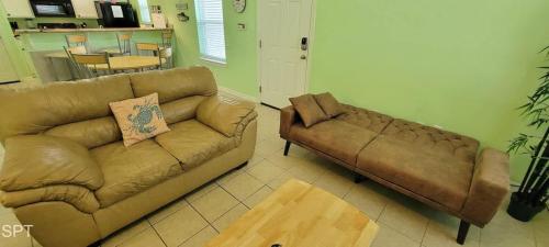a living room with a couch and a table at Los Cabos I #5 condo in South Padre Island