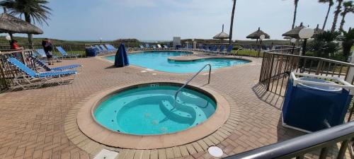 a large swimming pool in a resort at Saida Royale 9018 condo in South Padre Island