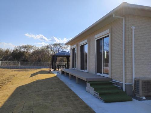 a house with a porch with a gazebo at Seaside House Cozy - Vacation STAY 03320v in Sammu