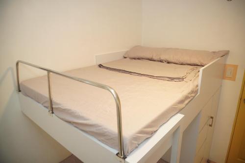 a bunk bed in a white room with a mattress at Fabulous Condo Suite One Spatial Tower2 in Iloilo City