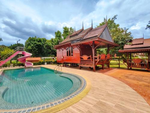 a house with a swimming pool and a gazebo at Tayama Farm Khaoyai in Nakhon Ratchasima