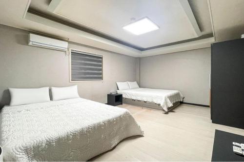 Katil atau katil-katil dalam bilik di Motel MJ