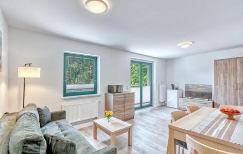 a living room with a couch and a table at Beautiful Apartment In Altenkirchen With Wifi in Altenkirchen