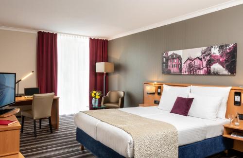 Un ou plusieurs lits dans un hébergement de l'établissement Leonardo Hotel Düsseldorf Airport Ratingen