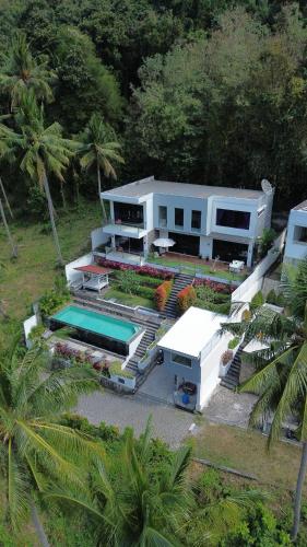 an aerial view of a house with a swimming pool at The Jungle Villa, Lombok in Mangsit