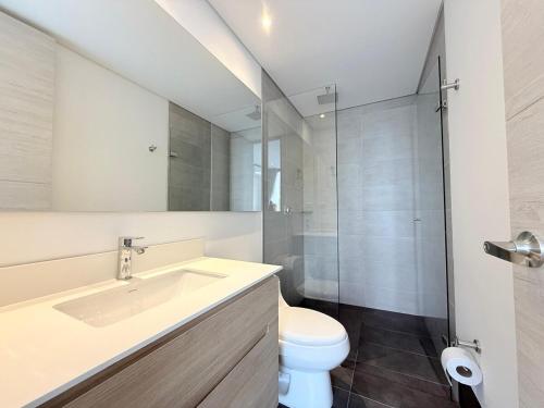 a bathroom with a sink and a toilet and a shower at Poblado de lujo in Medellín