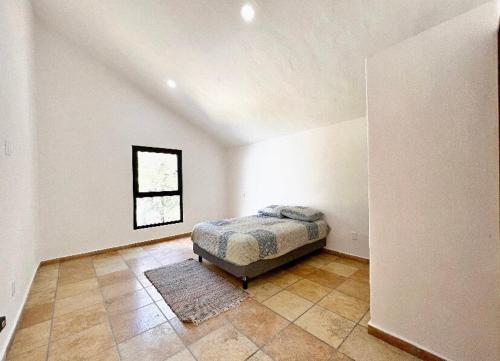 Cama o camas de una habitación en Villa Lorena es un Lugar Magico para desconectarte
