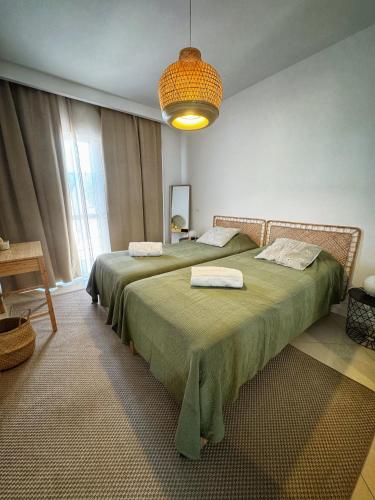 Ліжко або ліжка в номері Mindelo Bay Apartment
