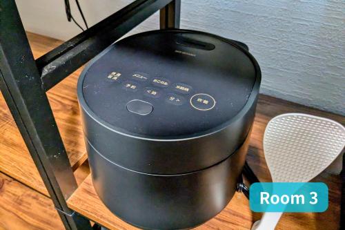 a black router sitting on top of a table at Vacation House 1 in Funabashi