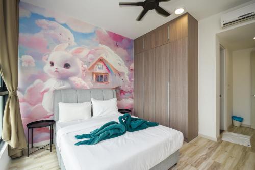a bedroom with a white bed with a hello kitty mural at Macrolink Medini Theme Suite by Nest Home - Near Legoland in Iskandar Puteri
