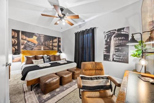 a bedroom with a bed and a ceiling fan at Classic Louisville Home with Contemporary Upgrades in Louisville