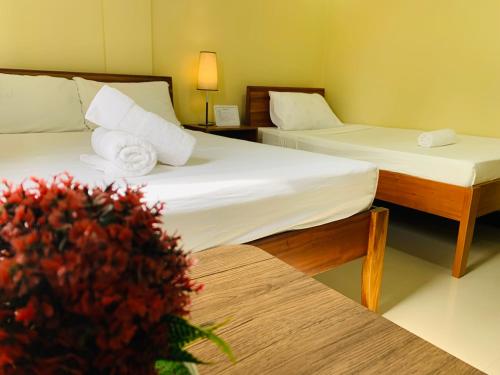 Una cama o camas en una habitación de MCA Hotel Suites