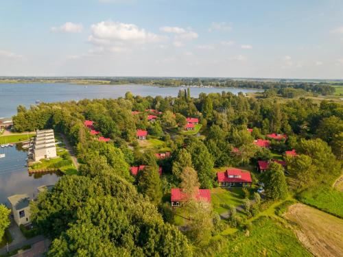 an aerial view of a resort with a lake at Accessible Villa on the Lake in Midlaren
