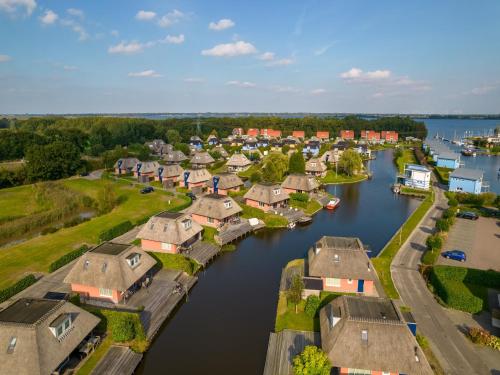 an aerial view of a village on a river at Accessible Villa on the Lake in Midlaren