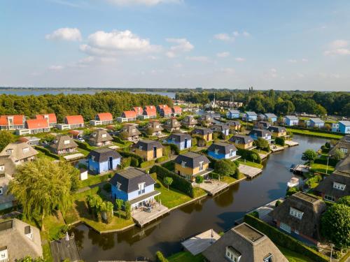 an aerial view of a town with a river at Lakeside Retreat in Drenthe in Midlaren