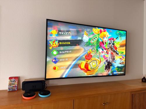 Una televisión o centro de entretenimiento en 洞爺 Private Inn Kazu