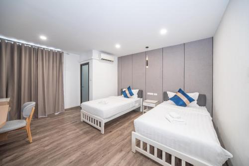Postel nebo postele na pokoji v ubytování Moca Hotel