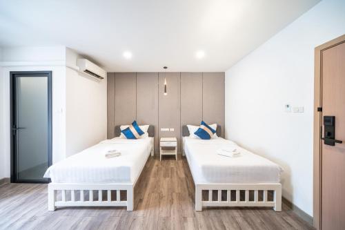 Postel nebo postele na pokoji v ubytování Moca Hotel