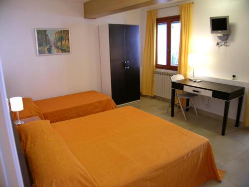 Postel nebo postele na pokoji v ubytování B&B Casa in Laguna