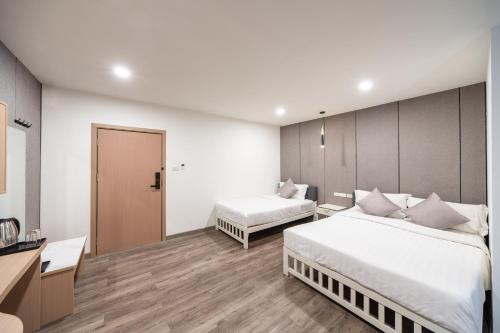 Postel nebo postele na pokoji v ubytování Moca Hotel