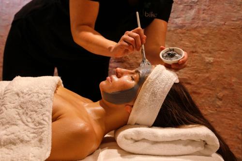 a woman getting her hair washed in a salon at Rydges Resort Hunter Valley in Lovedale