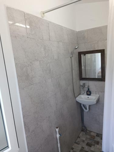 a bathroom with a sink and a mirror at Max Night Dreams in Bucharest