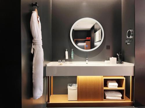 a bathroom with a sink and a mirror at Hilton Garden Inn Xi'An Bell Tower in Xi'an