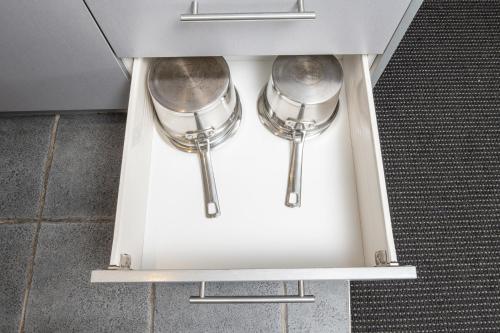 two silver utensils in a drawer in a kitchen at Grove Park Motor Lodge in Blenheim
