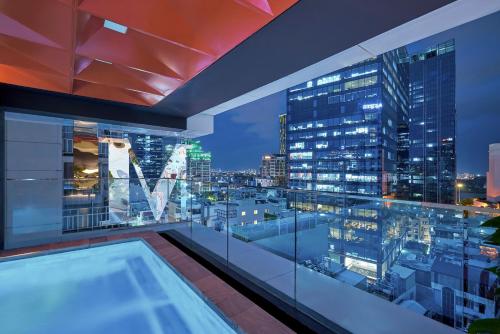 a view of a city skyline from a building at Signature by M Village Lê Thánh Tôn in Ho Chi Minh City