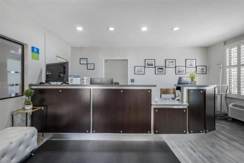 an office with a desk with a computer in it at SureStay Hotel by Best Western Beverly Hills West LA in Los Angeles