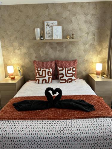 En eller flere senge i et værelse på L'Écrin Numéro 5 - Mini suite chic & romantique