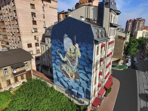 a mural on the side of a building at Senator Victory Square in Kyiv