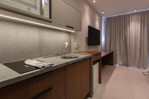 TV a/nebo společenská místnost v ubytování Yume Maceió By You