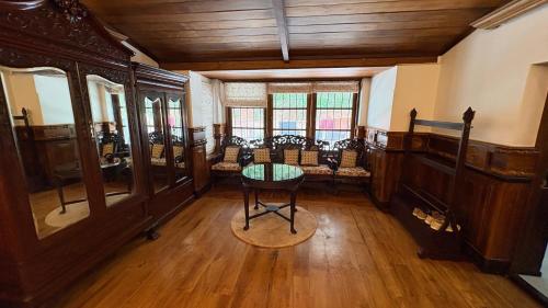an empty room with a table and chairs in it at Milntown Kaynes in Wellington Town