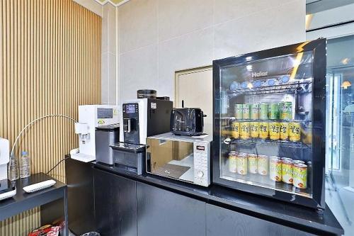 a refrigerator filled with drinks on a counter at Namunuelbo Hotel Uhbang Branch in Sambang-dong