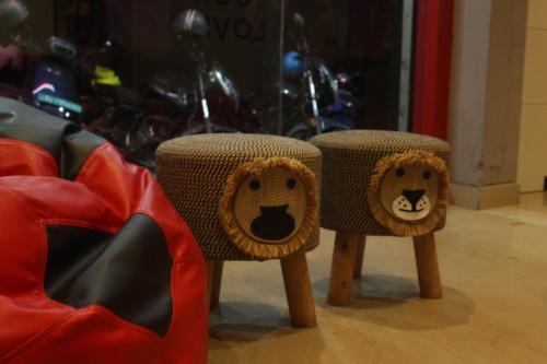 two chairs with stuffed lion heads on them at Tokyo Dorms in Kozhikode
