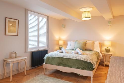 a bedroom with a bed with two teddy bears on it at Central Whitchurch - Lowcross House Guest Bedroom 3 in Whitchurch