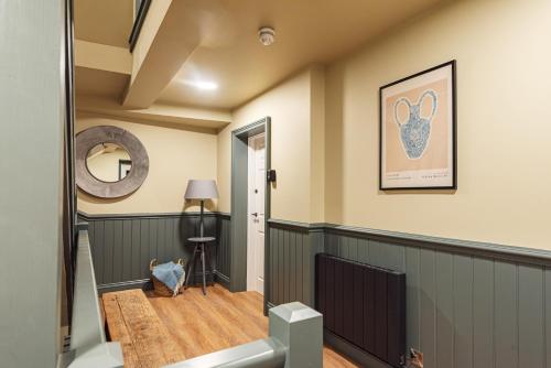 a room with a hallway with a table and a mirror at Central Whitchurch - Lowcross House Guest Bedroom 3 in Whitchurch